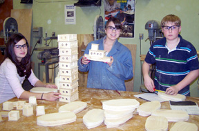 Pictured are Meaghan Bruner, Lauren Beshears and Sheldon Klinkefus with their tug boats.