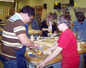 JC Enriquez, Kendra Ross, Kyle Bruegeman and Ethan Tassell building airplanes.