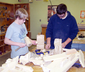 This photo shows Michael Karel and Mitch Jungert building their truck and trailer hauling cars.