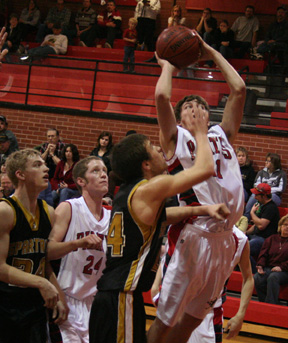 Conner Rieman goes for a basket against Timberline.