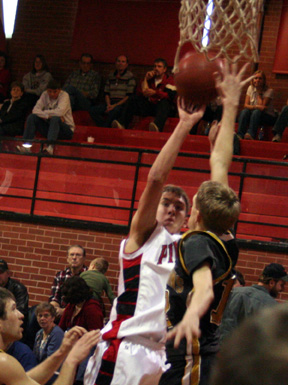 Devin Schmidt puts up a jump shot for 2 of his 16 points against Timberline.