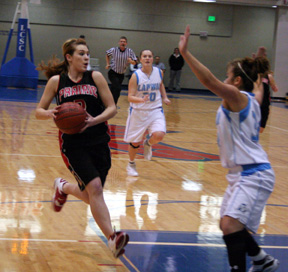 Kristi Poxleitner goes to the hoop against Lapwai.