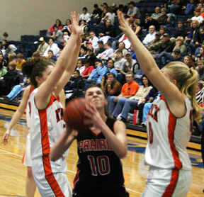 Tiffany Schaeffer looks for an opening through the Kendrick defenders' arms.