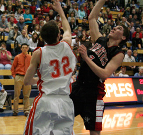 Eric Daly put up a shot against Troy.