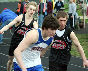 Kris Banning hands off to Jon Rice in the 4x200 relay. They team with David Sigler and Devin Schmidt to take 2nd in the event.