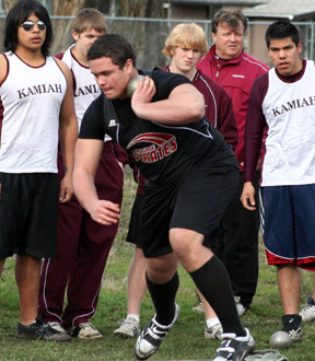 Kyler Shumway goes into his spin in the shot put. He won the event.