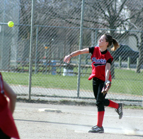 Alli Holthaus throws out a Lewis County runner at first.