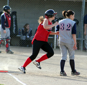 Brooke Holthaus rounds first on a double.