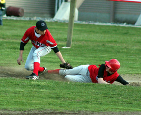 Eric Daly slides safely into third.