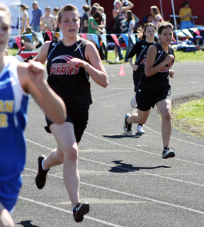 From left are Casey Bruegeman, Justina Zigler and Amber Frei in a heat of the 400 meter dash.