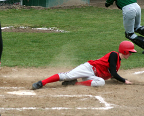Eric Daly slide in safe at home with a run against Culdesac.