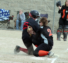 Kara Guyer is safe at third with one of two triples in the second game against Troy.