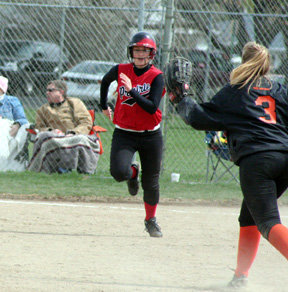 Leora Laurino digs for second on a bases clearing triple against Troy.