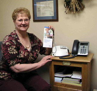 Ginny Acheson, Lifeline Coordinator, is installing new personal call units in the homes of area residents whove ordered the service.  It is provided by SMH-CVHC Home Health in conjunction with Lifeline, a medical alert service.