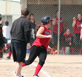 Brooke Holthaus rounds first with one of her 4 hits against Troy.