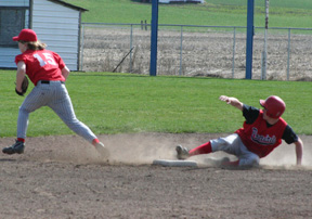 Eric Daly gets up to head for third after the catcher's throw sails into centerfielder on his stolen base.