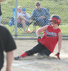 Kara Guyer slides home for the first run of the championship game.