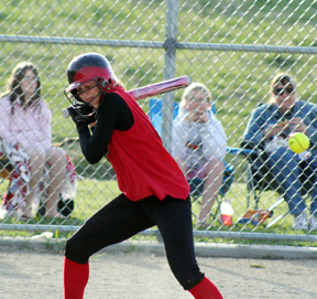 Tiffany Schaeffer cringes just before getting hit in the back with a pitch in the championship game.
