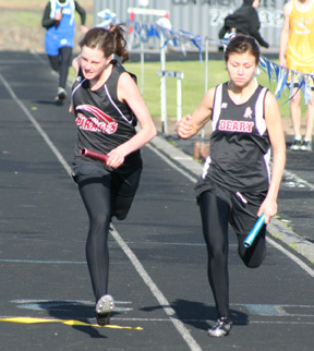 NaTosha Schaeffer leaned out Deary's anchor runner at the finish for second place in the girls 4x200 relay at the White Pine League meet. This despite the team dropping the baton on the first handoff.