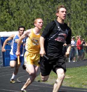 Jon Rice runs the curve in the boys 4x100 competition which Prairie's team of Rice, Kyle Daly, Devin Schmidt and David Sigler won.