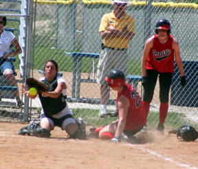 Kara Guyer scores with the second run on a sacrifice fly by Hilaree VanderPas. Tiffany Schaeffer tells Kara to slide after having already scored herself on the play.