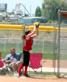 Kim Schaeffer makes a catch up against the fence of a foule pop-up in the championship game.
