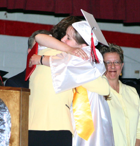 Not every grad hugs the school board member handing them their diploma but when it's also your mother . . . Della and Jessica Gehring.