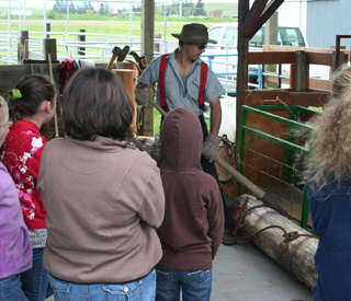Students are shown how they used to roll logs and keep them under control.