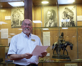 Lyle Wirtanen, Director, shows his delight at receiving a grant from the Laura Moore Cunningham Foundation, Inc. for the Historical Museum at St. Gertrude endowment.