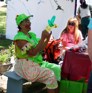 A clown made balloon animals for the children at the Kids Carnival.