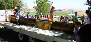 Kids climbed all over the dugout canoes at the craft fair.