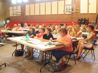 Teachers from CV and Prairie attend a training session for Step Up to Writing at the PES Gym.
