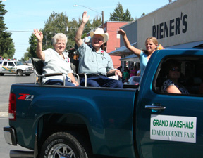 Grand marshals Ambrose and Margie Schumacher wave to the crowd.
