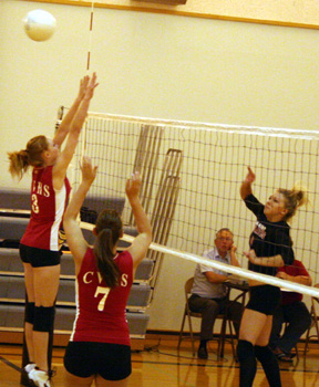 Brianne Stubbers spikes the ball against C.V.