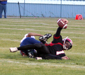 David Sigler shows the ball after making a first quarter interception.