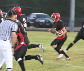Kyle Daly lets his blocking set up on a run early in the game. #3 at left is Tyler Forsmann.