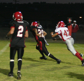 Tyrell Langston runs a sweep to the right and wound up with a touchdown. #2 is Conner Rieman.
