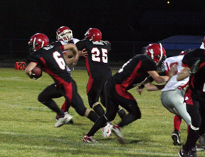 Branden Waller bursts through a hole provided by J.C. Enriquez, 25, and another unidentified Prairie blocker. Waller scored a touchdown on the play and wasnt touched by the defense until he crossed the goal line.