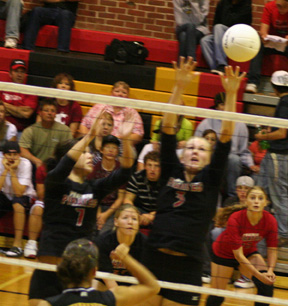 Francesca Johnson and Chelsea Long attempt to block a Gar-Pal spike.