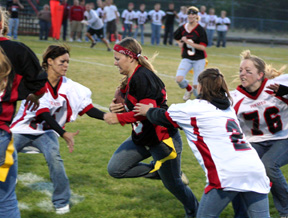 Jennifer Enneking runs into traffic in the Powder Puff game as Justina Zigler, Amber Frei and Dani Cochran all close in.