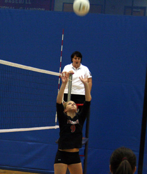 Brianne Stubbers sets the ball in the Timberline match at District.