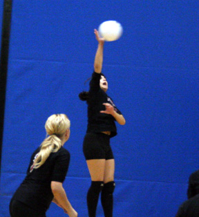 Sam Johnson goes high for a spike.