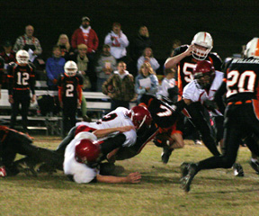 Conner Rieman and another Prairie defender tackle the Troy running back.