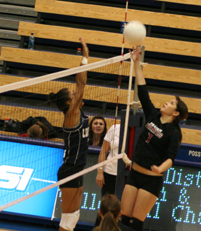 Francesca Johnson tips  the ball past a Lapwai blocker.