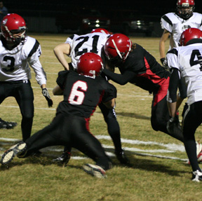 Branden Waller, 6, and another Prairie defender tackle the Deary ballcarrier.