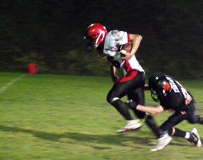 Branden Waller nears the goal line as a Kendrick defender misses on this tackle attempt.