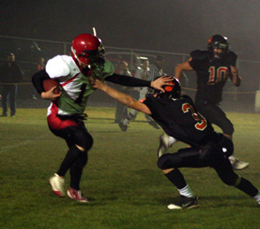 David Sigler stiff-arms a Kendrick defender on a 29 yard running play.