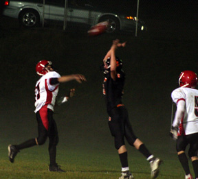 Kyle Holthaus gets a pass off over an onrushing defender.