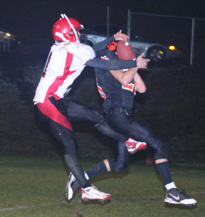 David Sigler breaks up a possible interception and nearly came down with the ball himself.