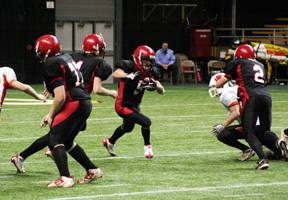 Ronnie Chandler, left, and Conner Rieman, right, help open a big hole for Kyle Daly.